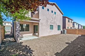 Sahuarita apartment for rent - a white house with a driveway and a tree in front of it