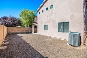 Sahuarita apartment for rent - the backyard of a house with a trash can in the driveway