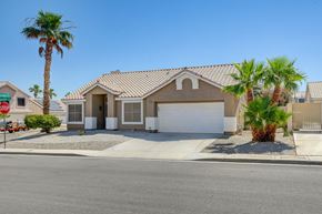 Henderson apartment for rent - A house with a brown roof and a white garage door.