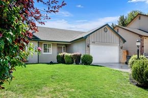 Boise apartment for rent - A house with a garage and a driveway.
