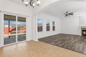 Meridian apartment for rent - A living room with a fireplace and a fan.