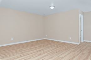 Meridian apartment for rent - an empty living room with wood floors and a white wall