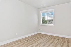 Nampa apartment for rent - A room with a window and wooden flooring.