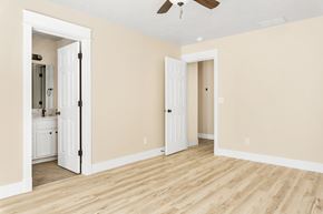 Boise apartment for rent - A room with a white door and a white cabinet with a white fridge.