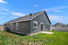 Nampa apartment for rent - A house with a grey siding and a satellite dish on the roof.