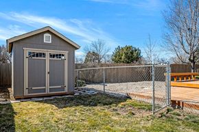 Meridian apartment for rent - a shed with a chain link fence and a backyard with a deck