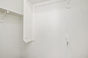 Tucson apartment for rent - a white wall with a whiteinder board and a white urinal in a bathroom