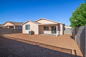 Tucson apartment for rent - a house with a driveway and a tree in front of it