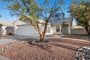 Tucson apartment for rent - A house with a tree in front of it.