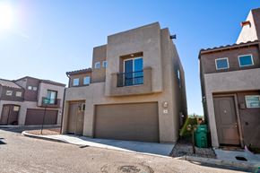 Vail apartment for rent - A modern house with a garage door and a window with a blue frame.