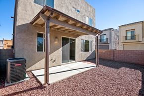 Vail apartment for rent - A house with a covered patio and a wall of windows.