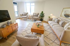 Moncton apartment for rent - A living room with a sofa, chairs, and a coffee table.