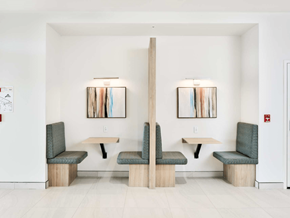 Moncton apartment for rent - A white room with two tables and four chairs.