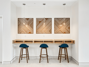 Moncton apartment for rent - A bar with three stools and three hanging lights.