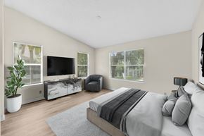 West Palm Beach apartment for rent - A bedroom with a large bed and a television.