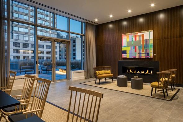 Jersey City apartment for rent - a living room with chairs and a fireplace