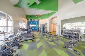 Las Vegas apartment for rent - a gym with weights and cardio equipment and windows