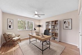 Coral Springs apartment for rent - A room with a desk, chair, and bookshelf.