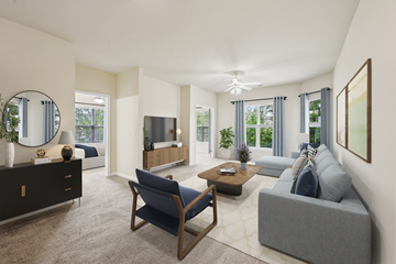 Columbus apartment for rent - A living room with a grey couch and a blue chair.