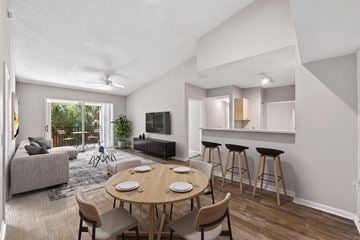 Miramar apartment for rent - A modern living room with a dining table and chairs.