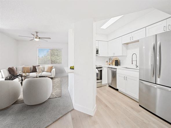 Mesa apartment for rent - a white living room with a kitchen and a table