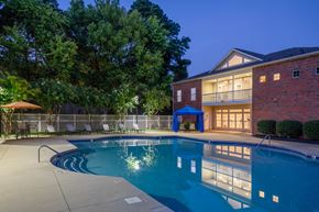 Charlotte apartment for rent - the preserve at ballantyne commons pool and building at night