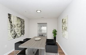 Charlotte apartment for rent - a dining room with a wooden table and chairs