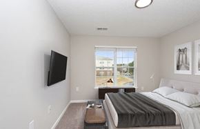 Charlotte apartment for rent - an empty bedroom with a bed and a window