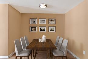 Charlotte apartment for rent - a dining room with a table and chairs and pictures on the wall