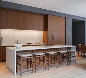Los Angeles apartment for rent - A modern kitchen with a white countertop and wooden cabinets.