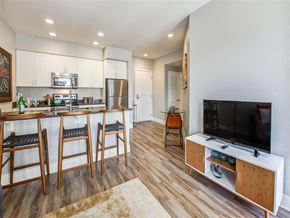 Northridge apartment for rent - a kitchen with a bar and a table with chairs