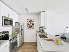San Francisco apartment for rent - a kitchen with white cabinets and stainless steel appliances