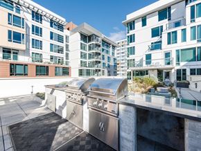 San Francisco apartment for rent - a stainless steel grill on a patio in front of a building