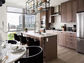 Washington apartment for rent - A modern kitchen with a dining table set for four.