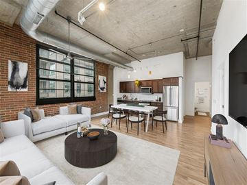Washington apartment for rent - A living room with a white couch and a coffee table.