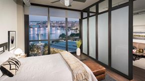 Washington apartment for rent - a bedroom with a large bed and a view of the water