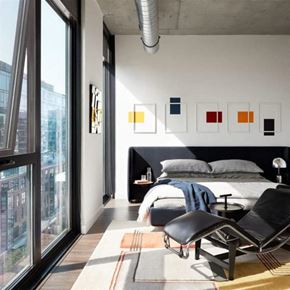 Washington apartment for rent - a bedroom with a bed and a chair next to a window