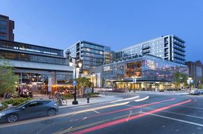 Washington apartment for rent - a city street with cars and buildings at night