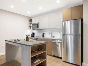 Washington apartment for rent - a kitchen with a stainless steel refrigerator