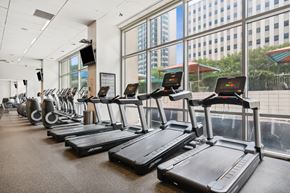 Dallas apartment for rent - A gym with treadmills and elliptical machines.