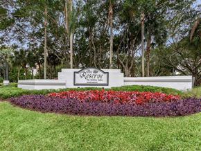 Boynton Beach apartment for rent - The property sign that reads The Reserve at Ashley Lake at the property entrance and nicely landscaped.