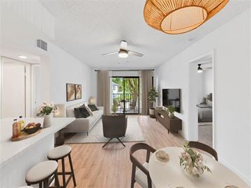 Boynton Beach apartment for rent - A modern living room with a dining table set up.