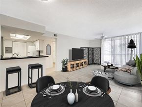 Coral Springs apartment for rent - a living room with a table and a television