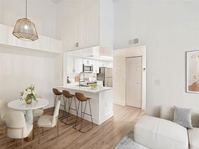 Coral Springs apartment for rent - A modern kitchen with a dining table and chairs.