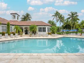 Coral Springs apartment for rent - a swimming pool with a house in the background