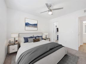 Jacksonville apartment for rent - a bedroom with a bed and a ceiling fan