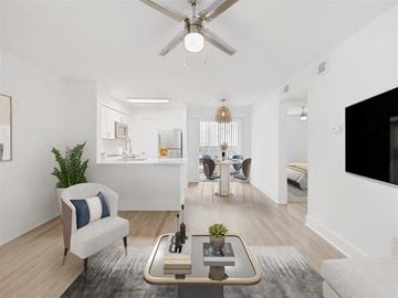 Jacksonville apartment for rent - A living room with a white couch and a coffee table in the center.