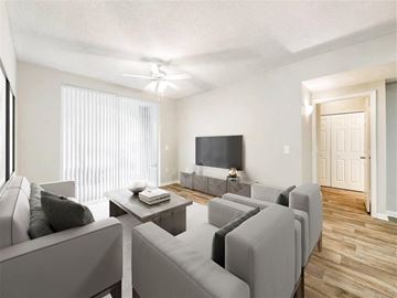 Miramar apartment for rent - A living room with grey couches and a flat screen TV.