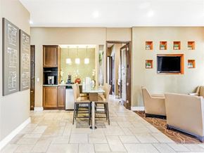 Miramar apartment for rent - A communal table located in the clubhouse next to lounge seating area.