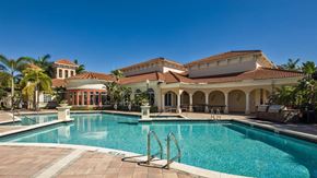 Miramar apartment for rent - a large swimming pool in front of a building